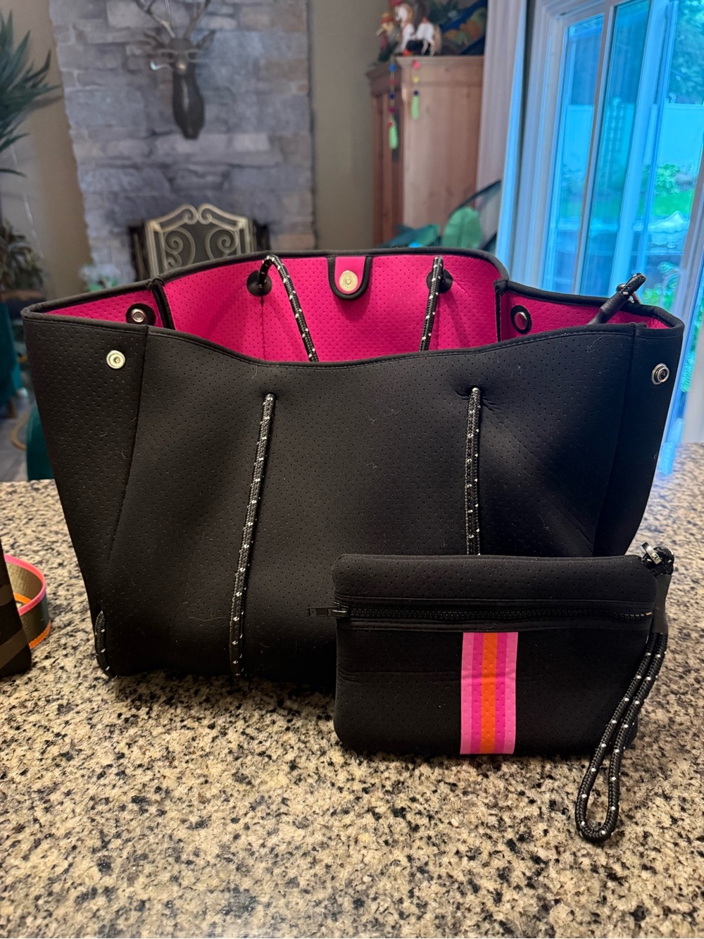 HAUTE SHORE Black Neoprene Tote with Hot Pink Interior and Striped Pouch
